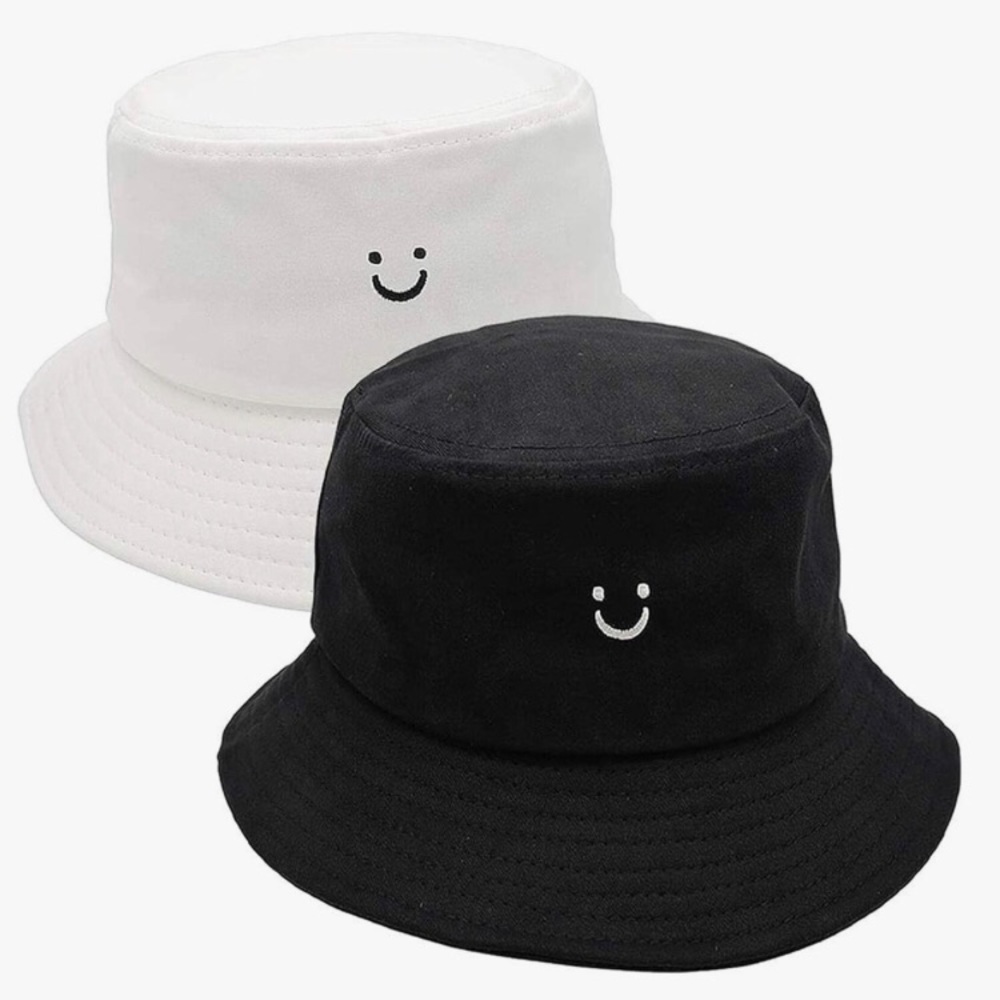 Black and white smiley face bucket hats